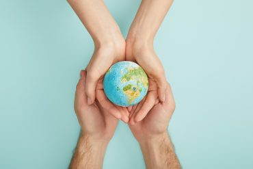 top view of man and woman holding planet model on 2021 09 01 14 37 51 utc